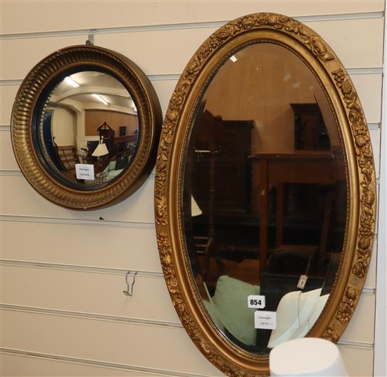 A late Victorian oval gilt framed wall mirror and a convex wall mirror (2) Convex mirror 33cm diameter